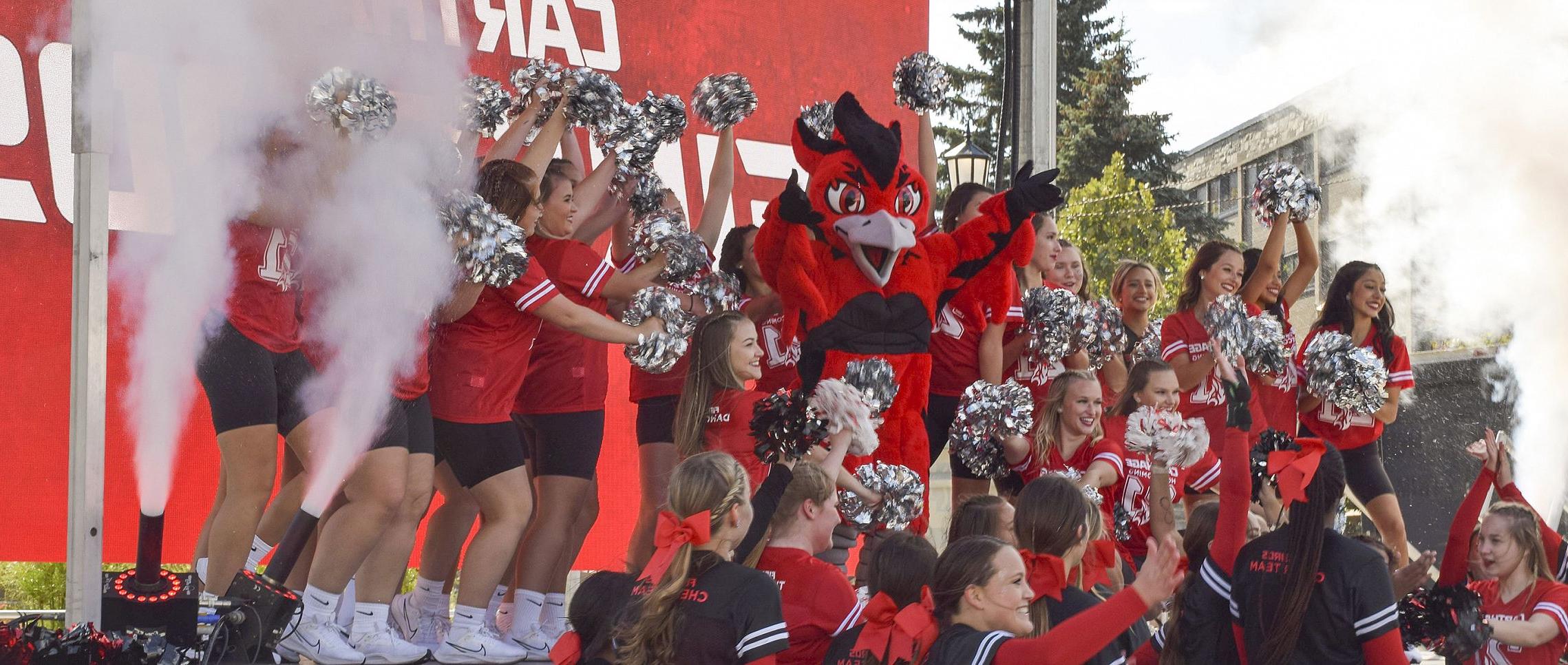 The Carthage College spirit team reveals Ember, the new 火鸟 mascot, during 首页coming Weekend 2021.